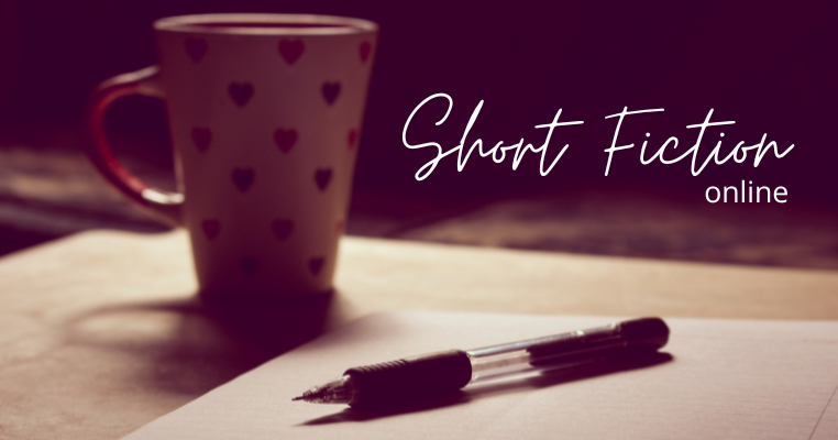 Image of a pen, and paper, with a mug in the background